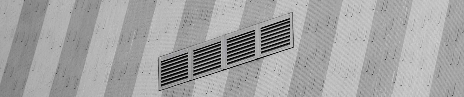 A Wall vent on a striped wall